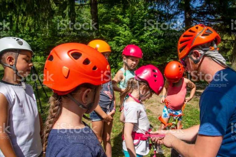 Children wearing climbing equipment